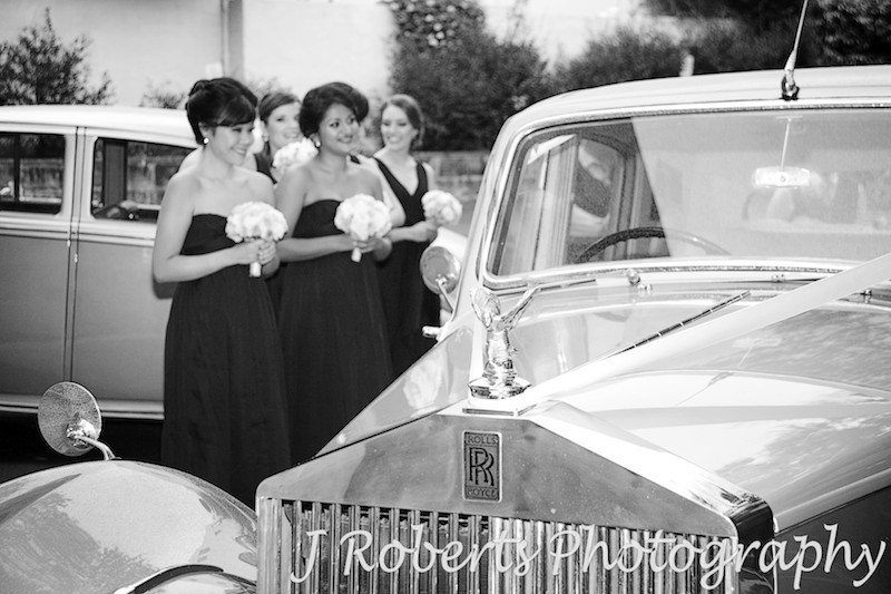 Rolls Royce bridal car with bridesmaids in the background - wedding photography sydney